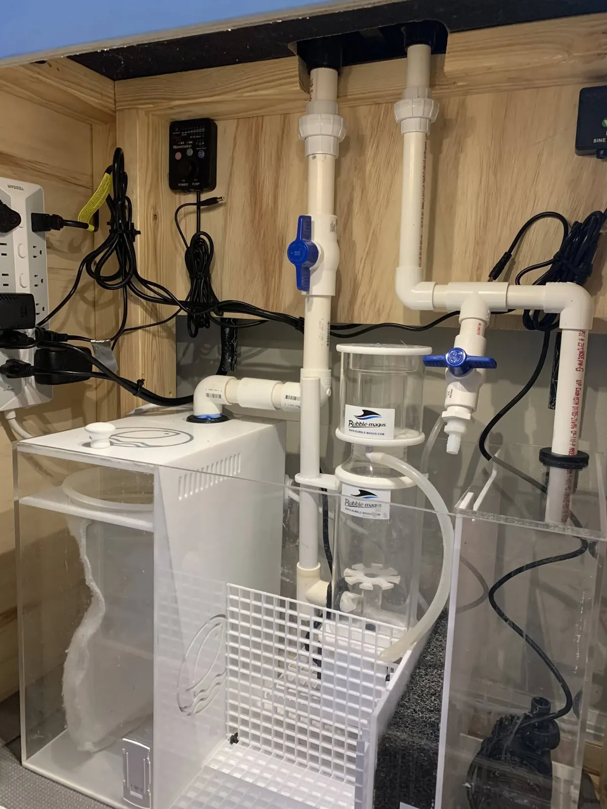Filtration room with plumbing, protein skimmer and controllers